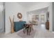 Bright living room with light wood flooring, a colorful rug, and stylish decor at 1813 Hillside Dr, Tampa, FL 33610
