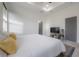 Bright main bedroom with tray ceiling, large windows, and closet at 1813 Hillside Dr, Tampa, FL 33610