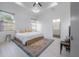 Bright main bedroom with tray ceiling, large windows, and ensuite bathroom at 1813 Hillside Dr, Tampa, FL 33610