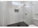 Sleek shower stall with glass enclosure and modern tiling at 1813 Hillside Dr, Tampa, FL 33610