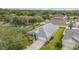 Aerial view of a single-story home with a well-maintained lawn, landscaping, and gray roof at 1932 Sean Wood Cir, Brandon, FL 33510