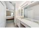 Functional bathroom featuring a vanity with a large mirror and ample lighting, conveniently located near the bedroom at 1932 Sean Wood Cir, Brandon, FL 33510