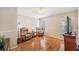 Cozy living room with hardwood floors, accent chairs, side tables, and natural light at 1932 Sean Wood Cir, Brandon, FL 33510