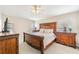 Spacious bedroom suite featuring detailed wood furniture, offering a comfortable and luxurious retreat at 1932 Sean Wood Cir, Brandon, FL 33510