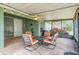 Relaxing screened patio with comfortable seating, ideal for outdoor enjoyment and entertaining guests at 1932 Sean Wood Cir, Brandon, FL 33510