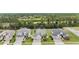 Scenic aerial view of a neighborhood showcasing well-manicured lawns, mature trees, and attractive single-Gathering homes at 19608 Lonesome Pine Dr, Land O Lakes, FL 34638