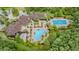 Birds-eye view of community pool and amenity center featuring pools and lounge areas at 19608 Lonesome Pine Dr, Land O Lakes, FL 34638