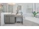 Bright bathroom featuring marble floors, a glass shower enclosure, and a luxurious soaking tub at 19608 Lonesome Pine Dr, Land O Lakes, FL 34638