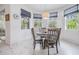 Cozy dining area features a round table surrounded by chairs with natural light at 19608 Lonesome Pine Dr, Land O Lakes, FL 34638