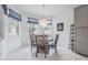 Dining nook with a round table, wooden chairs, and natural light from multiple windows at 19608 Lonesome Pine Dr, Land O Lakes, FL 34638