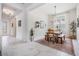 Dining room with tile floors, natural light, table, seating, and adjacent hallway at 19608 Lonesome Pine Dr, Land O Lakes, FL 34638