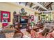 Cozy living area features a large entertainment center, comfortable seating, and a warm, inviting atmosphere at 19608 Lonesome Pine Dr, Land O Lakes, FL 34638