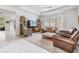Comfortable living room features plush seating, stylish decor, and a light-filled atmosphere at 19608 Lonesome Pine Dr, Land O Lakes, FL 34638