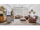 Bright living room featuring tray ceilings, stylish furnishings, and a large window for ample natural light at 19608 Lonesome Pine Dr, Land O Lakes, FL 34638