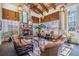 Cozy lounge area featuring a stone fireplace, comfortable seating, and lots of natural light at 19608 Lonesome Pine Dr, Land O Lakes, FL 34638