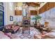 Inviting lounge area featuring a stone fireplace, comfortable seating, and lots of natural light at 19608 Lonesome Pine Dr, Land O Lakes, FL 34638