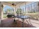 Enclosed patio featuring a ping pong table and lots of space for outdoor activities at 19608 Lonesome Pine Dr, Land O Lakes, FL 34638