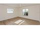Sunny bedroom with new flooring, natural light, and a modern ceiling fan at 2146 Waterside Dr, Clearwater, FL 33764