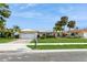 Charming single-story home featuring a two-car garage, lush lawn, and inviting curb appeal at 2146 Waterside Dr, Clearwater, FL 33764