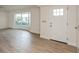 Bright, airy living room with new flooring and a large bay window providing ample natural light at 2146 Waterside Dr, Clearwater, FL 33764
