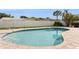 Backyard pool features brick pavers, in-ground pool with a white fence and lush landscaping at 2146 Waterside Dr, Clearwater, FL 33764