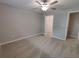 Bedroom with carpet flooring and a view of the walk-in closet at 23300 Willow Glen Way, Lutz, FL 33549