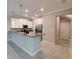 New kitchen featuring stainless steel appliances, granite countertops, and elegant pendant lighting at 23300 Willow Glen Way, Lutz, FL 33549