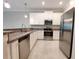 Modern kitchen featuring stainless steel appliances and granite countertops at 23300 Willow Glen Way, Lutz, FL 33549