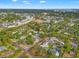Neighborhood aerial highlighting the property and surrounding area, surrounded by lush greenery and urban amenities at 241 72Nd N St, St Petersburg, FL 33710