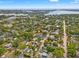 Serene neighborhood aerial shot showcasing the property amidst lush trees, highlighting its prime location at 241 72Nd N St, St Petersburg, FL 33710