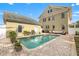 A large backyard features a beautiful pool, a lovely home, and an inviting outdoor space at 241 72Nd N St, St Petersburg, FL 33710