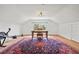 Bonus room features hardwood floors, a large desk and an ornate rug at 241 72Nd N St, St Petersburg, FL 33710