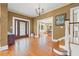 Welcoming entryway with hardwood floors, decorative door, and staircase at 241 72Nd N St, St Petersburg, FL 33710