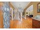 Grand foyer featuring hardwood floors, staircase, chandelier, and view into the living room at 241 72Nd N St, St Petersburg, FL 33710