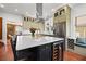 Modern kitchen with a large island, stainless steel appliances, and a wine fridge at 241 72Nd N St, St Petersburg, FL 33710