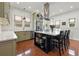 Modern kitchen with a large island, stainless steel range hood, and seating for four at 241 72Nd N St, St Petersburg, FL 33710