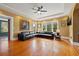 Bright living room featuring hardwood floors and natural light from multiple large windows at 241 72Nd N St, St Petersburg, FL 33710
