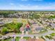 A beautiful aerial view shows the home's location near a pond and the community's proximity to the water at 2641 Big Pine Dr, Holiday, FL 34691