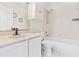 Well-lit bathroom featuring a vanity with a sink, toilet, and a shower-tub combination at 2641 Big Pine Dr, Holiday, FL 34691