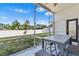 Enclosed lanai with table and chairs providing a relaxing outdoor space at 2641 Big Pine Dr, Holiday, FL 34691