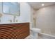 Stylish bathroom with a modern vanity, gold fixtures, and a tiled walk-in shower at 2870 Rampart Cir, Clearwater, FL 33761