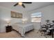 Comfortable bedroom features a ceiling fan, neutral walls, carpet, and window for natural light, plus drums at 2870 Rampart Cir, Clearwater, FL 33761