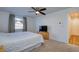 This bedroom features a ceiling fan, neutral walls and carpet, plus a TV stand at 2870 Rampart Cir, Clearwater, FL 33761