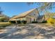 Charming single-Gathering home featuring a two-car garage, well-maintained landscaping, and a welcoming entrance at 2870 Rampart Cir, Clearwater, FL 33761