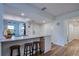 Modern kitchen features sleek countertops, stylish bar stool seating, recessed lighting, and open design at 2870 Rampart Cir, Clearwater, FL 33761