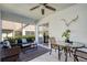 Outdoor lanai featuring tiled floor, ceiling fan, comfortable seating, plus room for dining at 2870 Rampart Cir, Clearwater, FL 33761