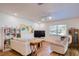 Inviting living room featuring modern furniture, wood flooring, built-in shelving, and natural light at 2870 Rampart Cir, Clearwater, FL 33761