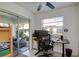 Bright office with sliding glass doors opening to an outdoor seating area at 2870 Rampart Cir, Clearwater, FL 33761