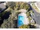 Aerial shot displaying a community pool, complemented by lounge chairs and green landscaping at 2870 Rampart Cir, Clearwater, FL 33761