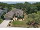 Beautiful aerial view of a well-maintained home with lush landscaping, a spacious lawn, and a two-car garage at 3350 Stonebridge Trl, Valrico, FL 33596